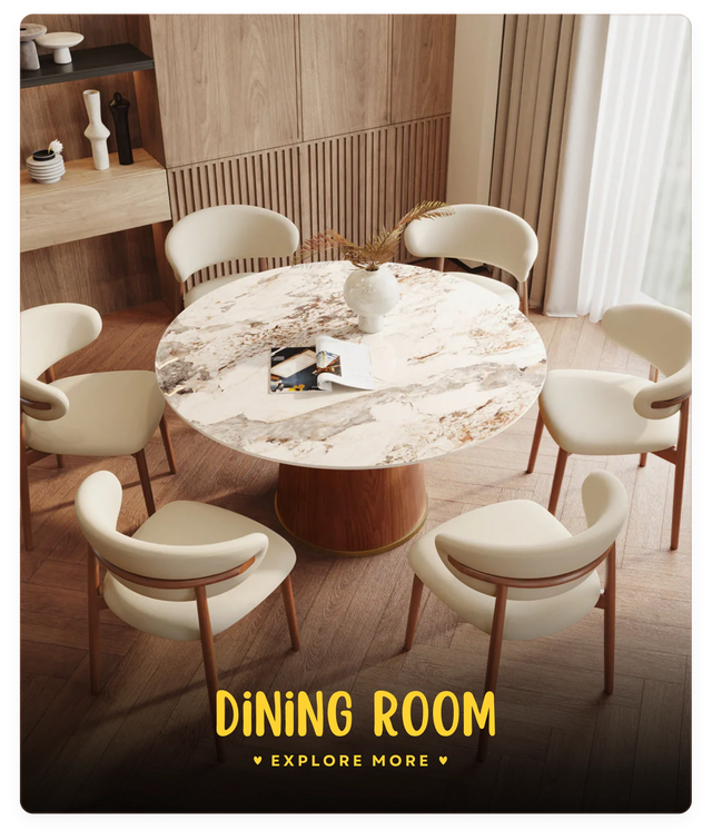Dining room setup with a marble table and chairs in a well-lit room.